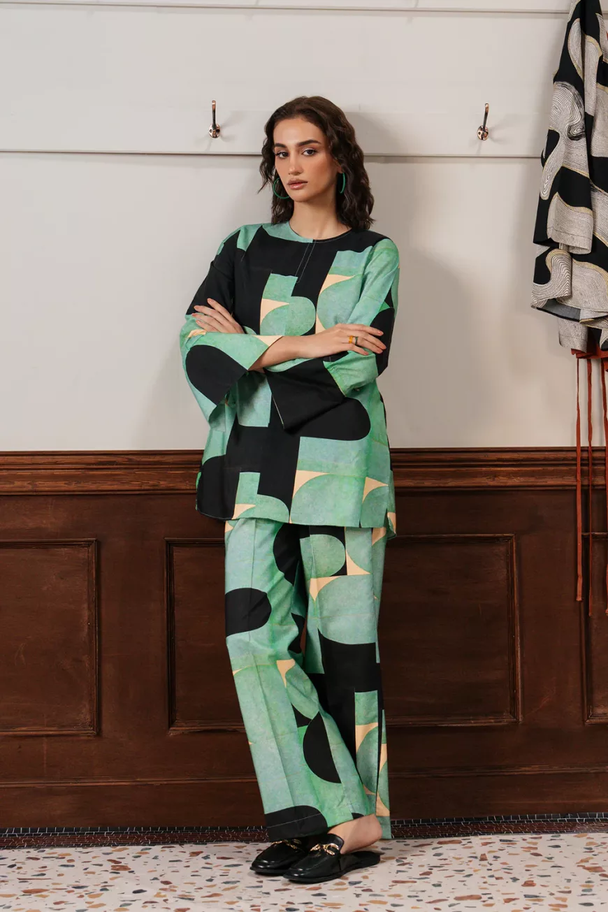 "Bold women's two-piece outfit featuring a green fluorescent viscose top with artistic multicolor print and matching wide-leg pants – statement coord set"