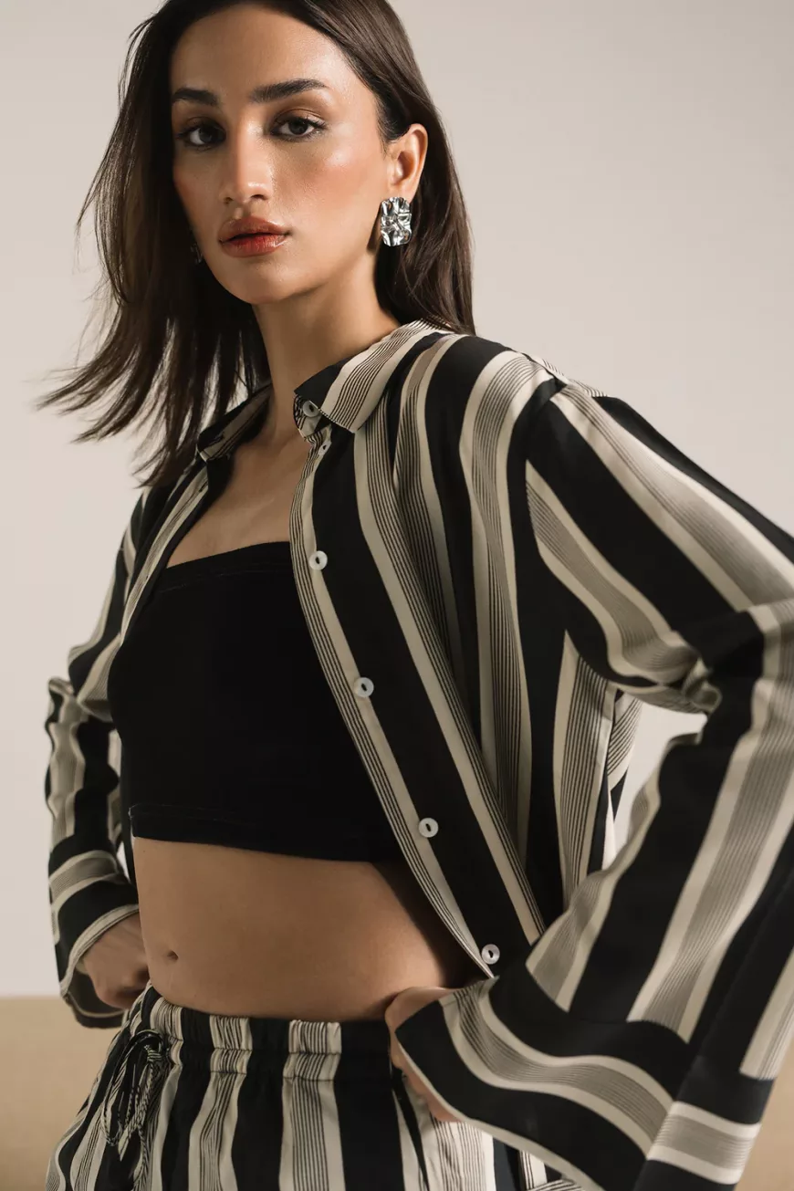 "Women's deep black striped two-piece outfit featuring a button-down collar top and matching flared viscose pants – monochrome coord set"