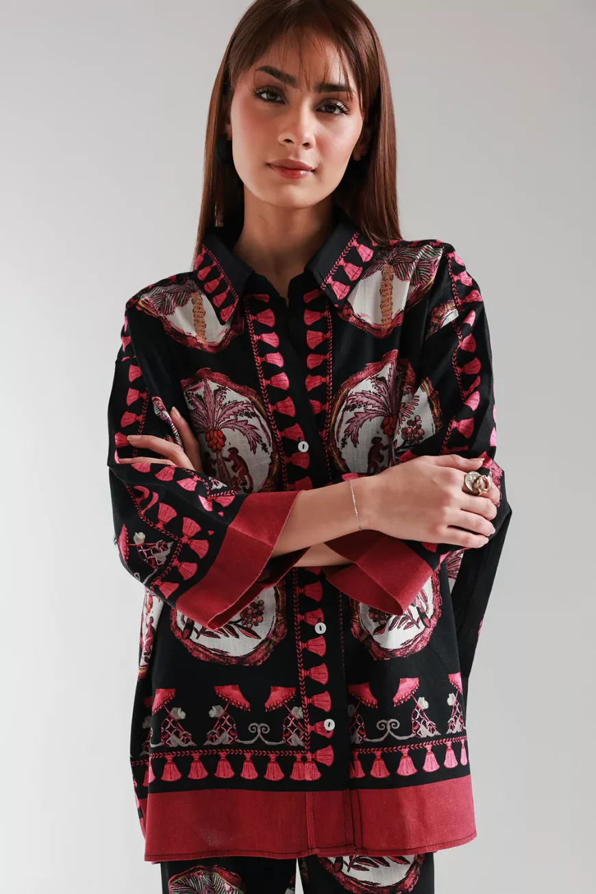 "Women's black co-ord set with pink and maroon floral print, featuring a short button-down top with bell sleeves and matching straight culotte pants – stylish 2-piece outfit"