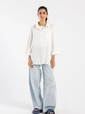 Model wearing white button-down shirt in viscose linen